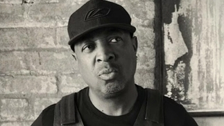 Close-up black-and-white image of rapper Chuck D