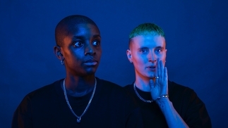 SHERELLE and I. JORDAN against a blue backdrop