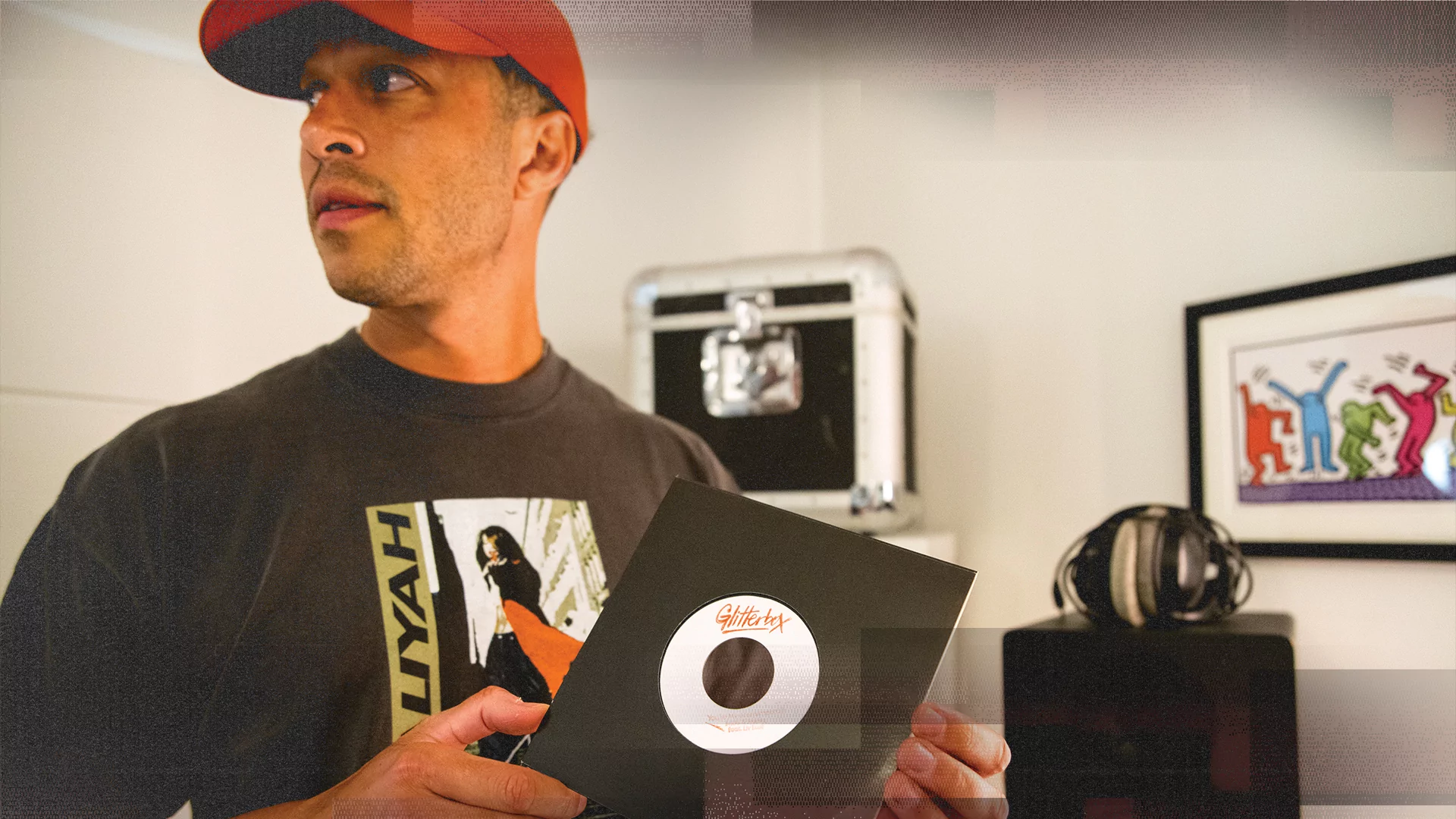 Photo of Melvo Baptiste holding a Glitterbox record