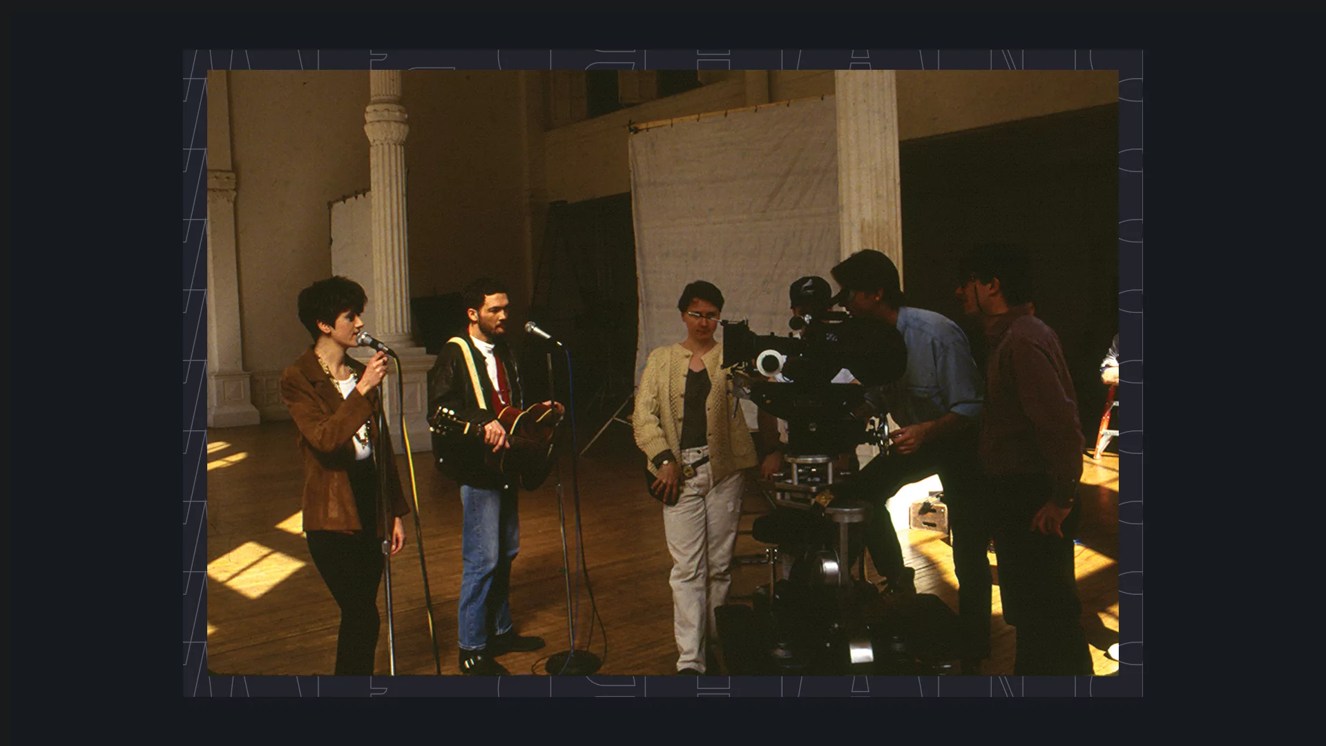 Photo of Everything But The Girl filming a music video in a large hall