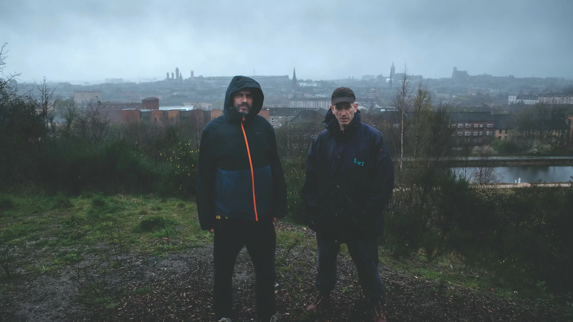 Optimo with the view of Glasgow from the Necropolis behind them