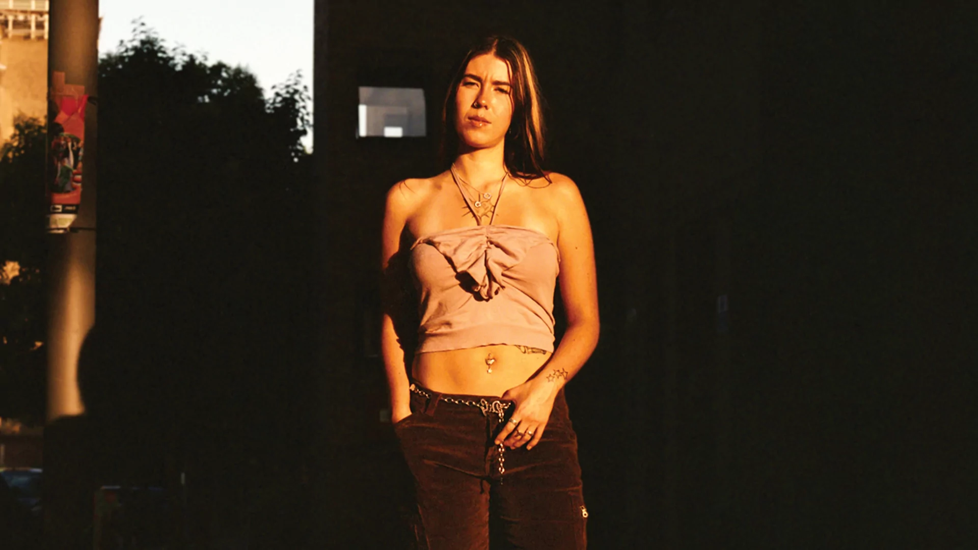 Press shot of Silva Snipa standing on a London street at dusk